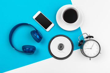 Blue headphones on blue and white color background