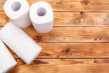 Roll of paper towel on wooden background