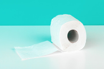 Roll of toilet paper or tissue  on color background