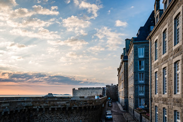 The walls and houses of Saint Malo at sunset