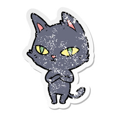distressed sticker of a cartoon cat staring