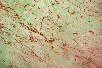 part of grungy green scratched paint on metal surface