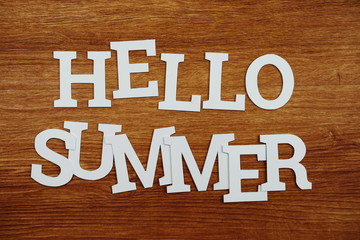 Hello Summer alphabet letters on wooden background