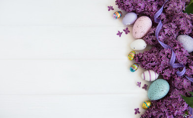 Spring lilac flowers and easter eggs