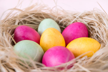 eggs, Easter, pink, yellow, green Easter eggs in the nest,