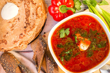 1 plate of borscht with greens and sour cream, pancakes, Russian food,