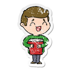 distressed sticker of a cartoon laughing man holding book