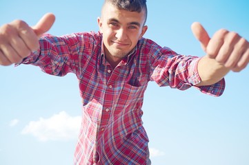 young man with thumbs up