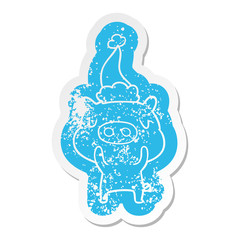 cartoon distressed sticker of a content pig wearing santa hat