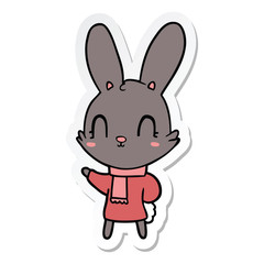 sticker of a cute cartoon rabbit wearing clothes