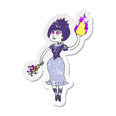 retro distressed sticker of a cartoon vampire girl casting fireball