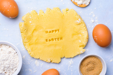 Easter Baking Background, Dough with Happy Easter Lettering