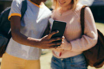 Students taking selfie at college campus