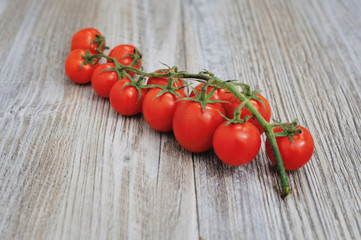 Cherry tomatoes isolated over white background