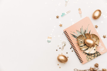 Happy Easter! Stylish stationery background with gold eggs on white background. Table decorating for holiday. Feminine flat lay. Blog easter concept.