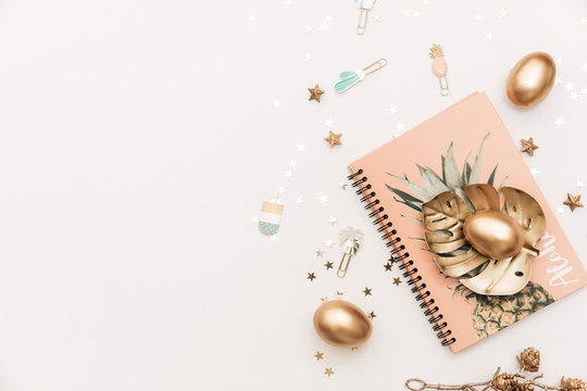 Happy Easter! Stylish stationery background with gold eggs on white background. Table decorating for holiday. Feminine flat lay. Blog easter concept.