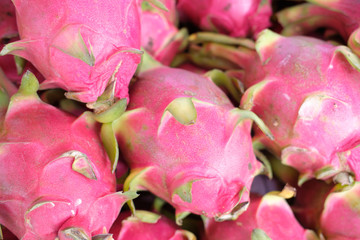 Healthy dragon fruit in tropical market photo