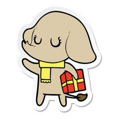 sticker of a cute cartoon elephant with gift