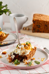 carrot fruit cake with nuts and cream