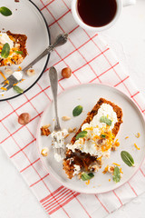 carrot fruit cake with nuts and cream