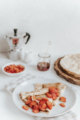 Shrovetide maslenitsa festival meal, rustic style, wooden background - traditional russian blini