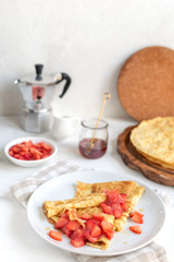 Shrovetide maslenitsa festival meal, rustic style, wooden background - traditional russian blini