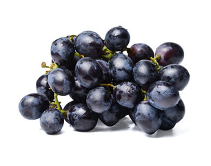 Fresh bunch of black grapes. White isolated background. Close-up. Side view.