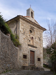 Fototapeta na wymiar Small religious building, church or pieve, Pognana village near Verrucola in Lunigiana area of north Tuscany, Italy.