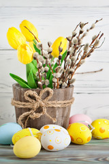 Happy Easter. Congratulatory easter background. Easter eggs and flowers. Selective focus.
