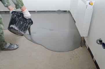Self-leveling epoxy. Leveling with a mixture of cement floors.
