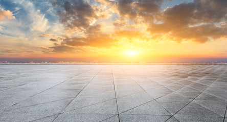 Empty square floor and modern city skyline with beautiful colorful clouds at sunset