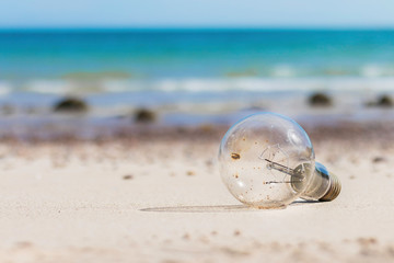  Old light bulb on the beach