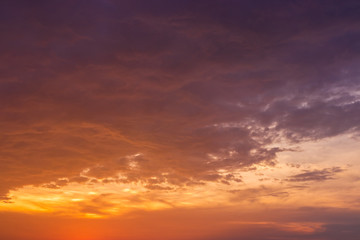 Naklejka na ściany i meble dramatic sunset with golden clouds