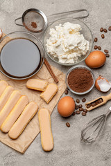 Ingredients for traditional tiramisu cake on concrete background