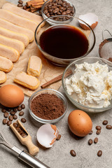 Ingredients for traditional tiramisu cake on concrete background