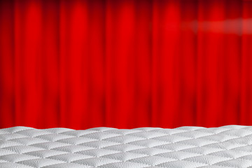 White quilted leather on table and red curtain in the background