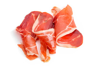 Jamon slices on white background