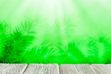 Wooden board with empty space on green abstract background