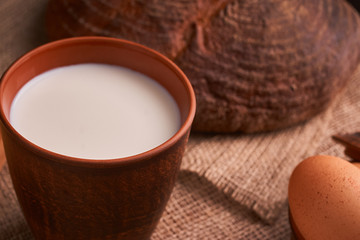 organic dairy products - milk, cheese, and also eggs, bread. on table