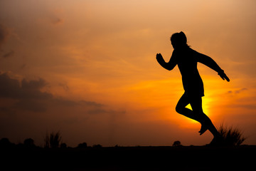 Fototapeta na wymiar young fitness woman running on sunset seaside trail - Image