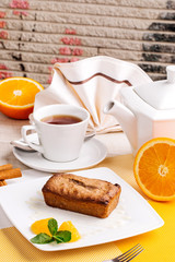 Muffin, mini cake, cup cake on a white plate with a tea