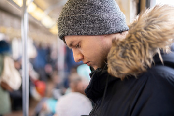 young derpessed person in public transport b