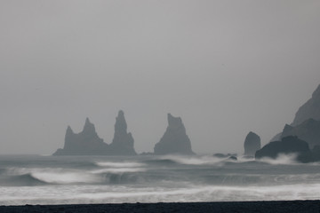 Viewpoint of Reynisfjara and Dyrh&oacute;laey during a stormy weather over the Atlantic ocean