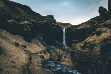 little known Kvernufoss waterfall next to skogafoss waterfall in southern Iceland in the winter view of the canyon 