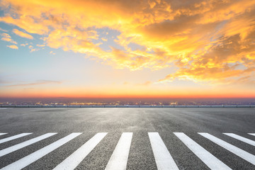 Zebra crossing road and modern city skyline in Shanghai at sunset,high angle view