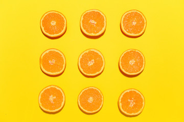 Ripe cut oranges on color background