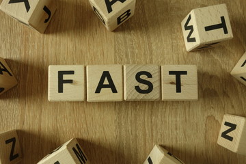 Fast word from wooden blocks on desk