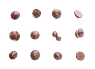 Delicious chocolate chips on white background