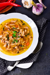 Traditional tripe soup in polish style with beef and vegetables