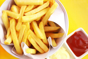 French fries with ketchup and mayonnaise, top view of potato fry.